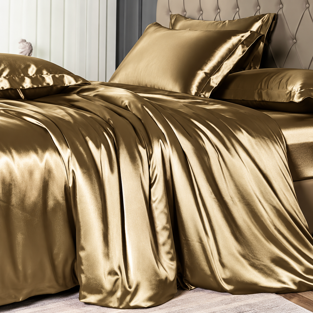 Close-up of champagne-gold satin bedding in an elegant bedroom