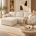 Black corduroy L-shaped sofa in a warm modern living room
